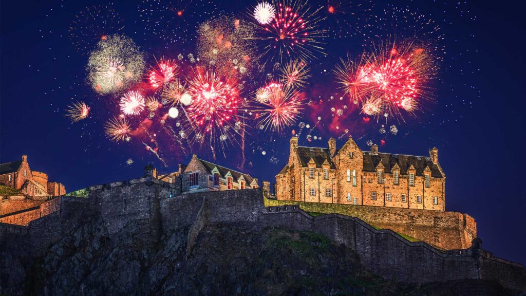 Fireworks in the sky over Edinburgh Castle as seen from the New Town.